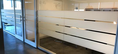 Privacy-Window-Films-of-Opaque-White-lines-along-conference-room-walls